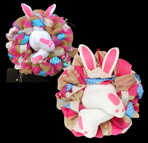 Decorative wreath with bunny design and colorful polka dots on a white background.