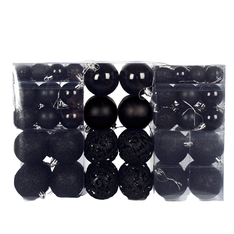 Set of black Christmas ornaments in a clear packaging box on a white background
