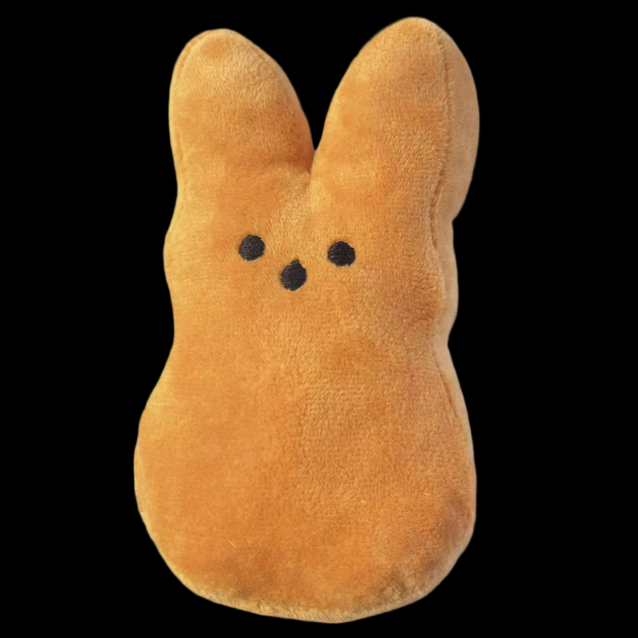 Plush toy shaped like a yellow duck with black eyes on a light gray background