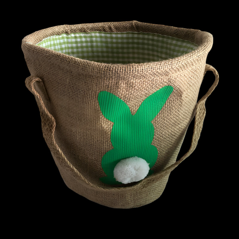 Burlap basket with green bunny design on a white background
