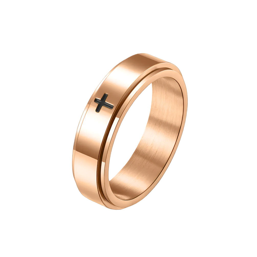 Rose gold ring with a black cross on a white background