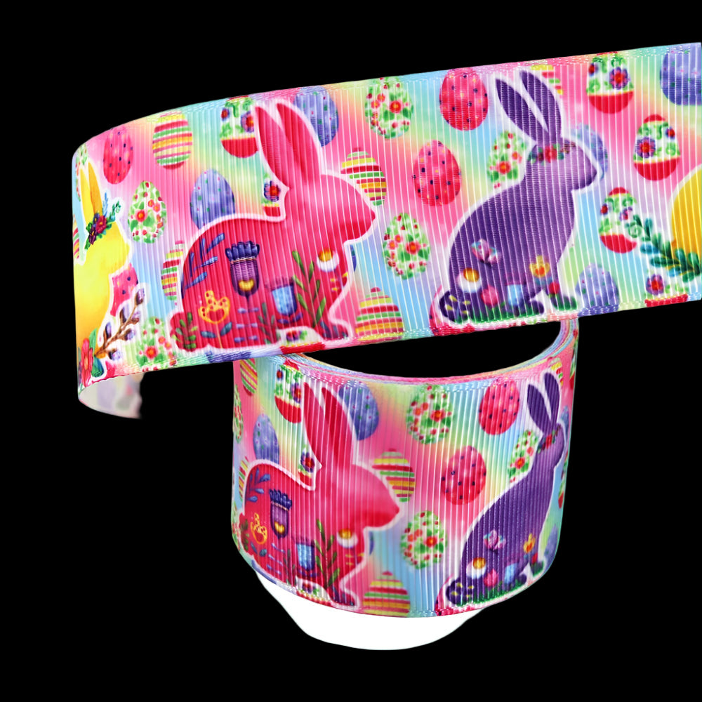 Colorful ribbon with Easter-themed design featuring bunnies and eggs on a white background.