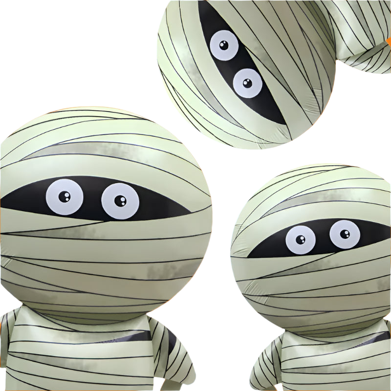 Three mummy-themed balloons with eyes on a white background