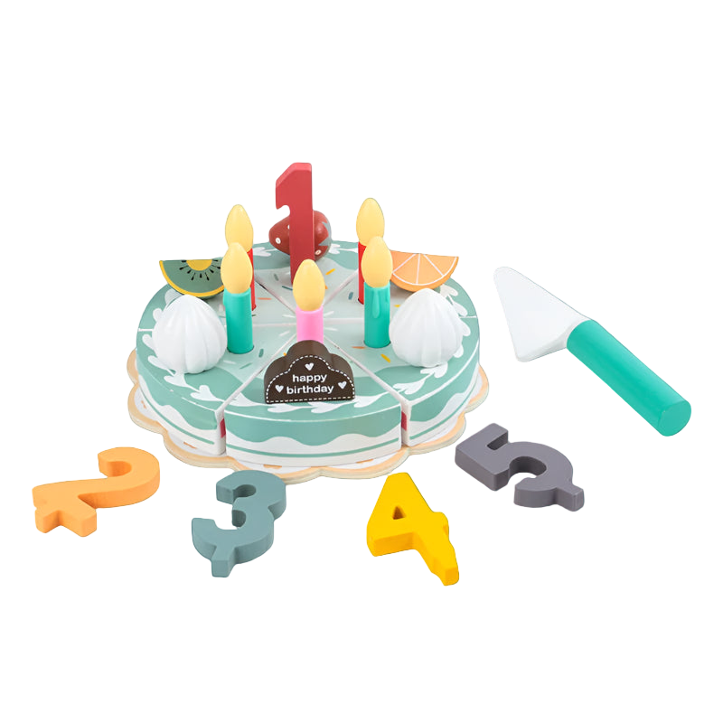 Toy birthday cake set with candles, letters, and a knife on a white background