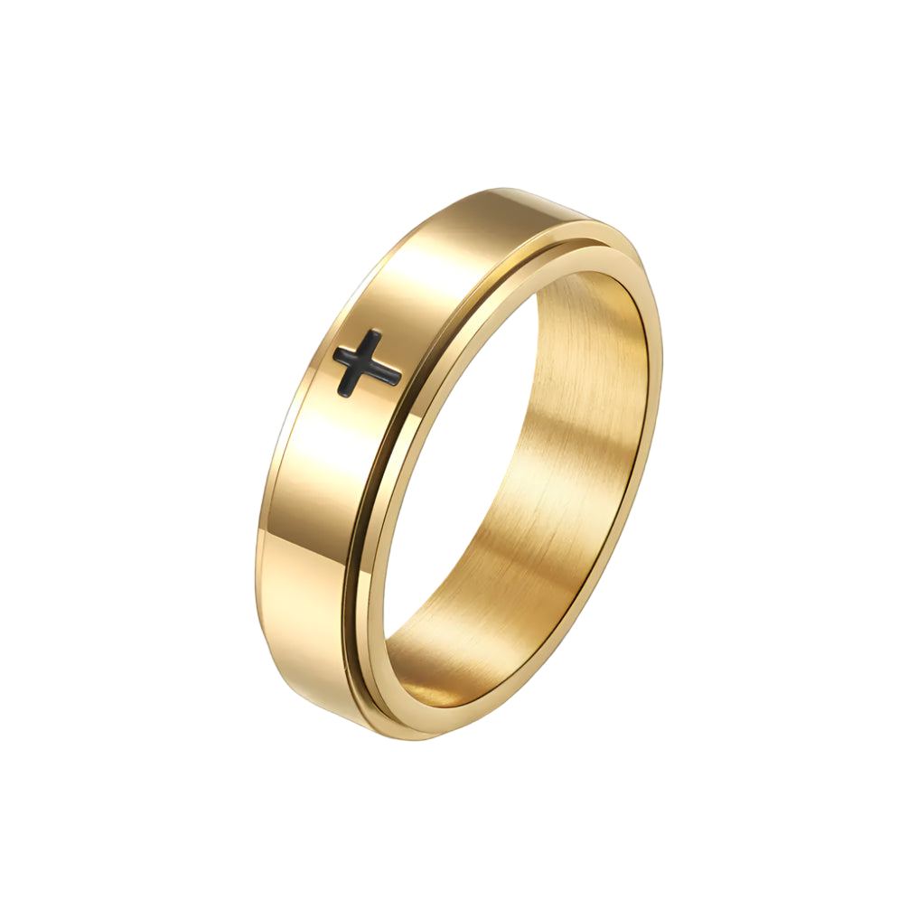 Gold ring with a black cross on a white background