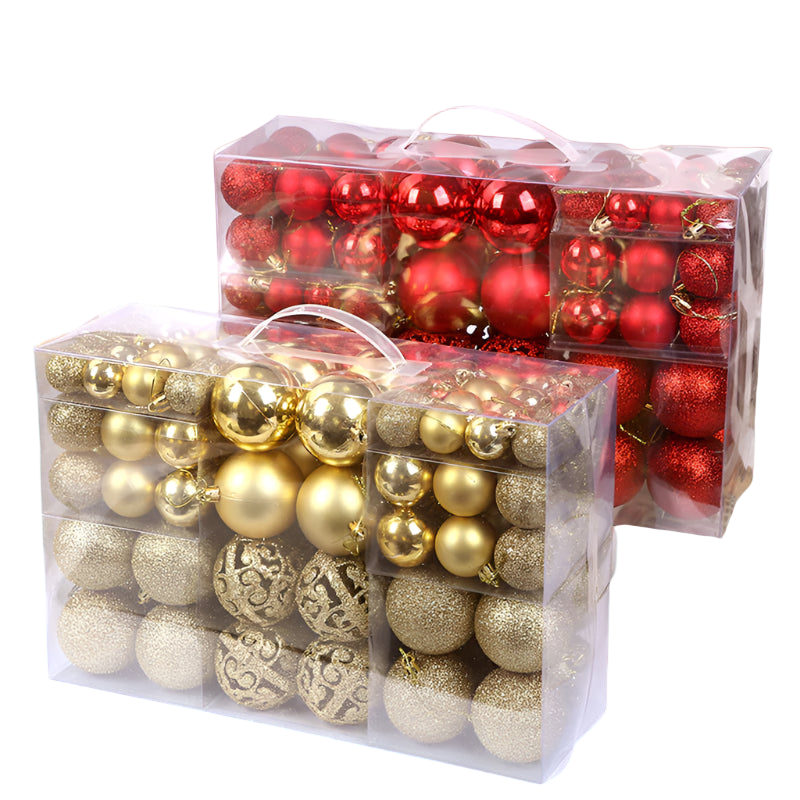 Clear plastic boxes filled with red and gold Christmas ornaments on a white background.