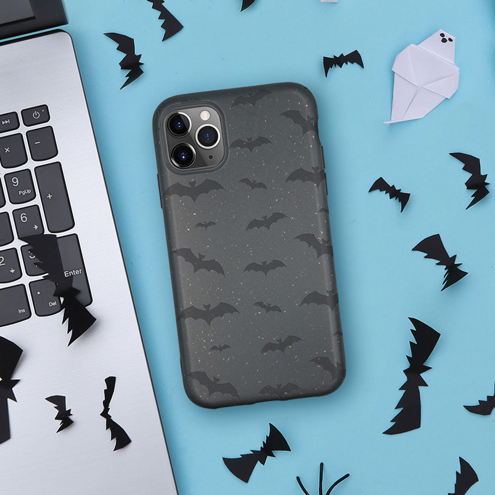 Phone case with bat pattern on a blue background with decorative bats and a ghost.