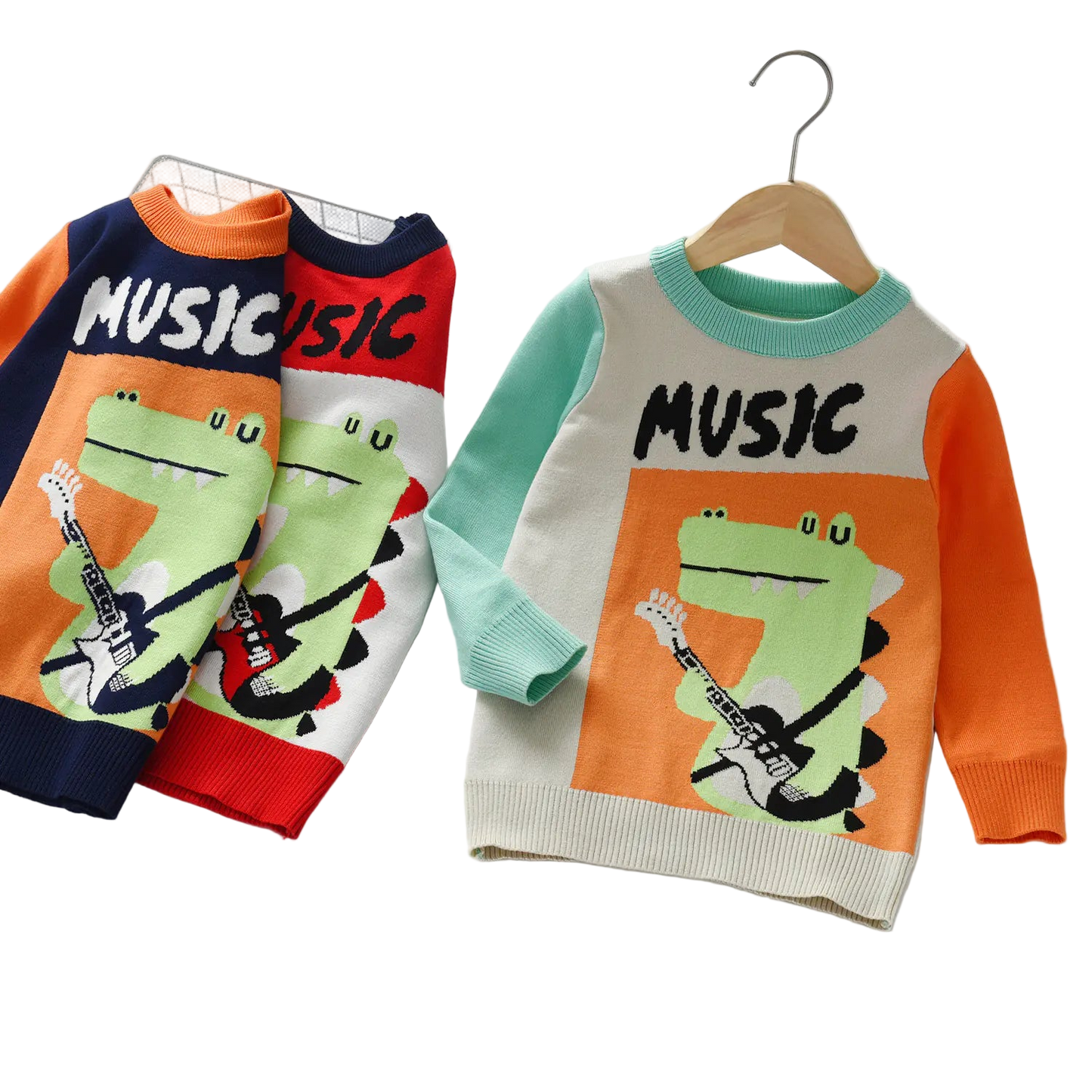 Two children's sweaters with a frog playing guitar design and 'Music' text on a white background.