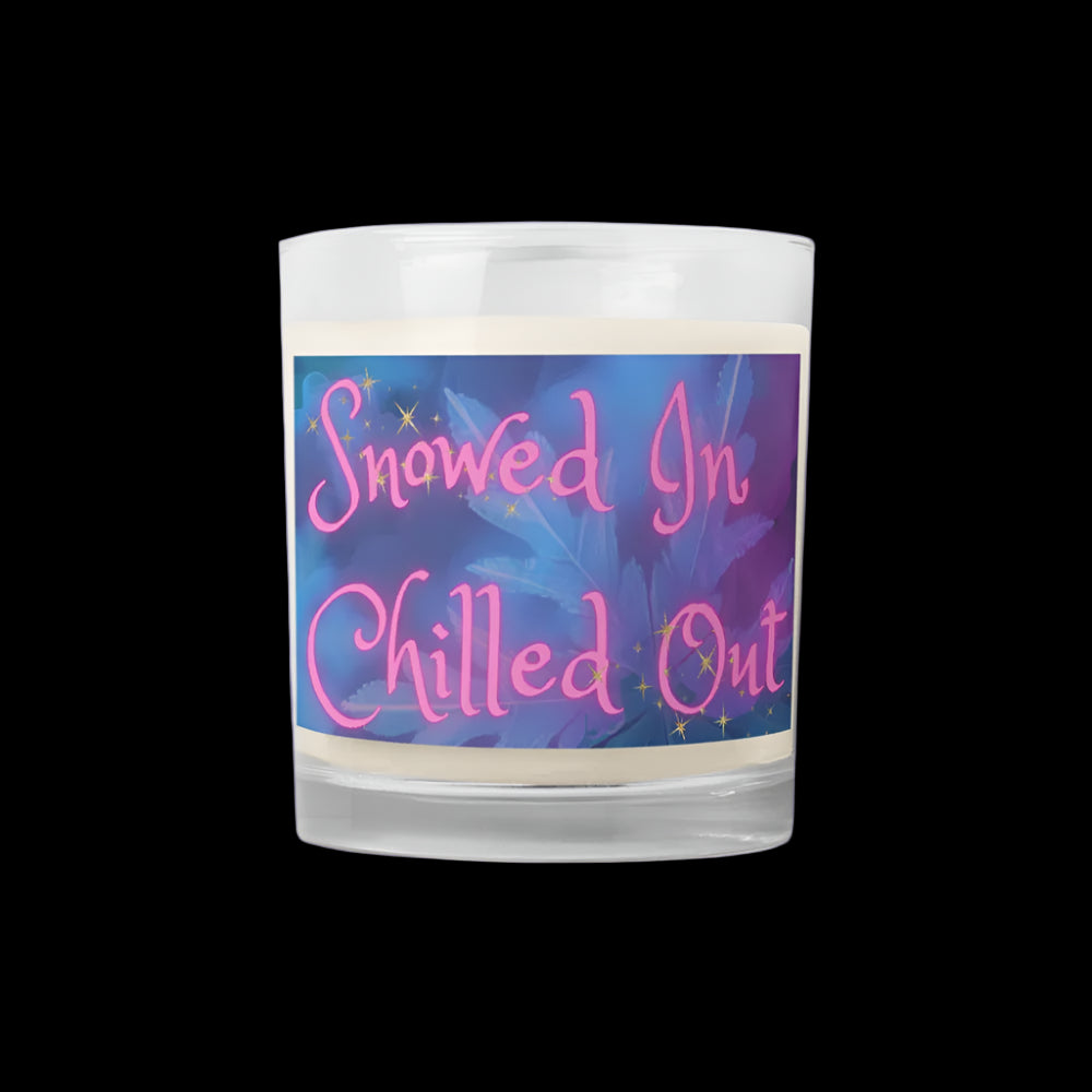Candle with a colorful label reading 'Snowed In Chilled Out' on a white background