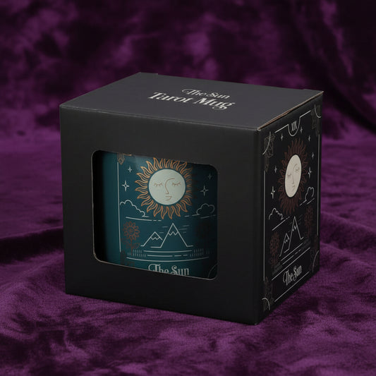 Mug with 'The Sun' design in a black box packaging