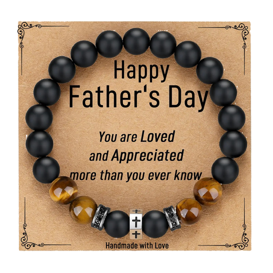 Black beaded bracelet with decorative elements on a 'Happy Father's Day' card.