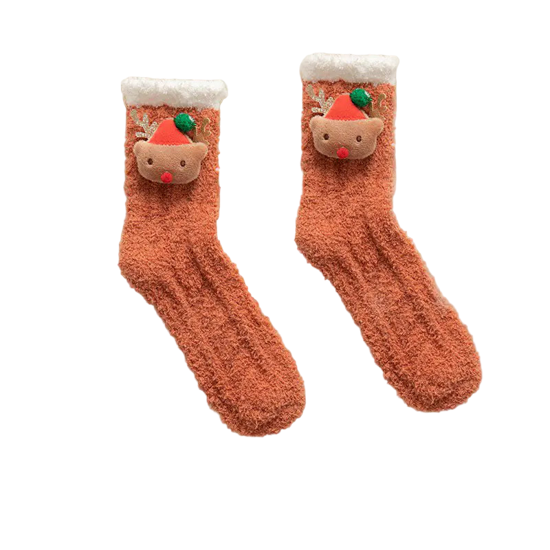 Pair of fluffy socks with reindeer faces on a white textured background