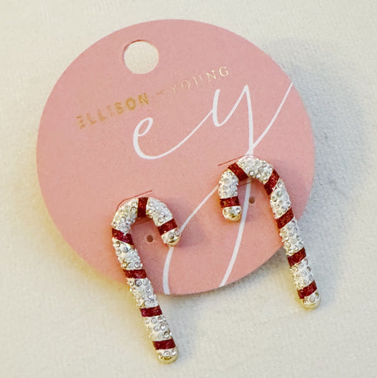 Candy cane-shaped earrings on a pink card with ' Ellison Young' branding.