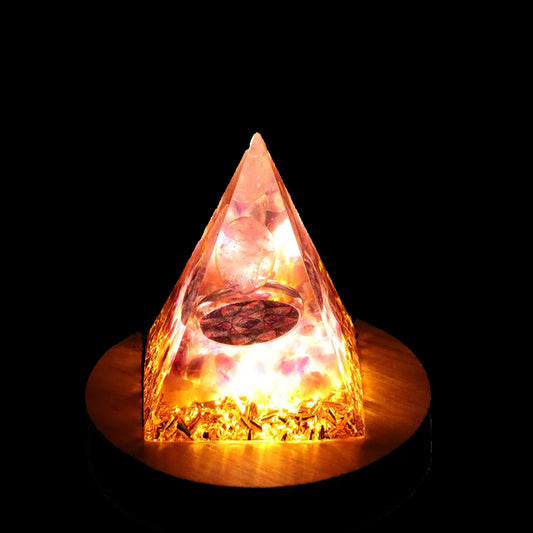 Pyramid-shaped light on a wooden base with a blurred background