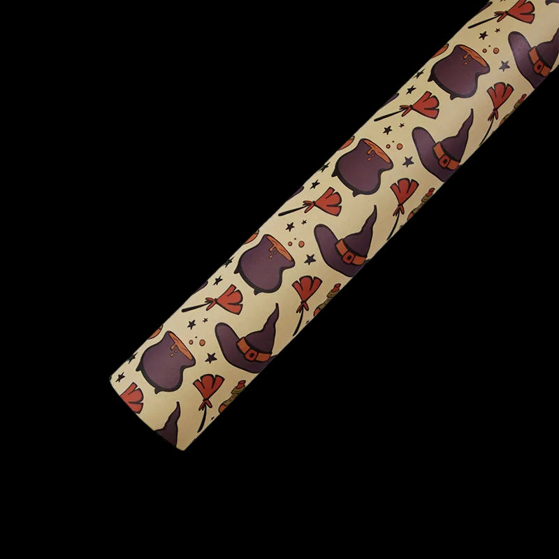 Roll of paper towel with witch hat pattern on a beige background