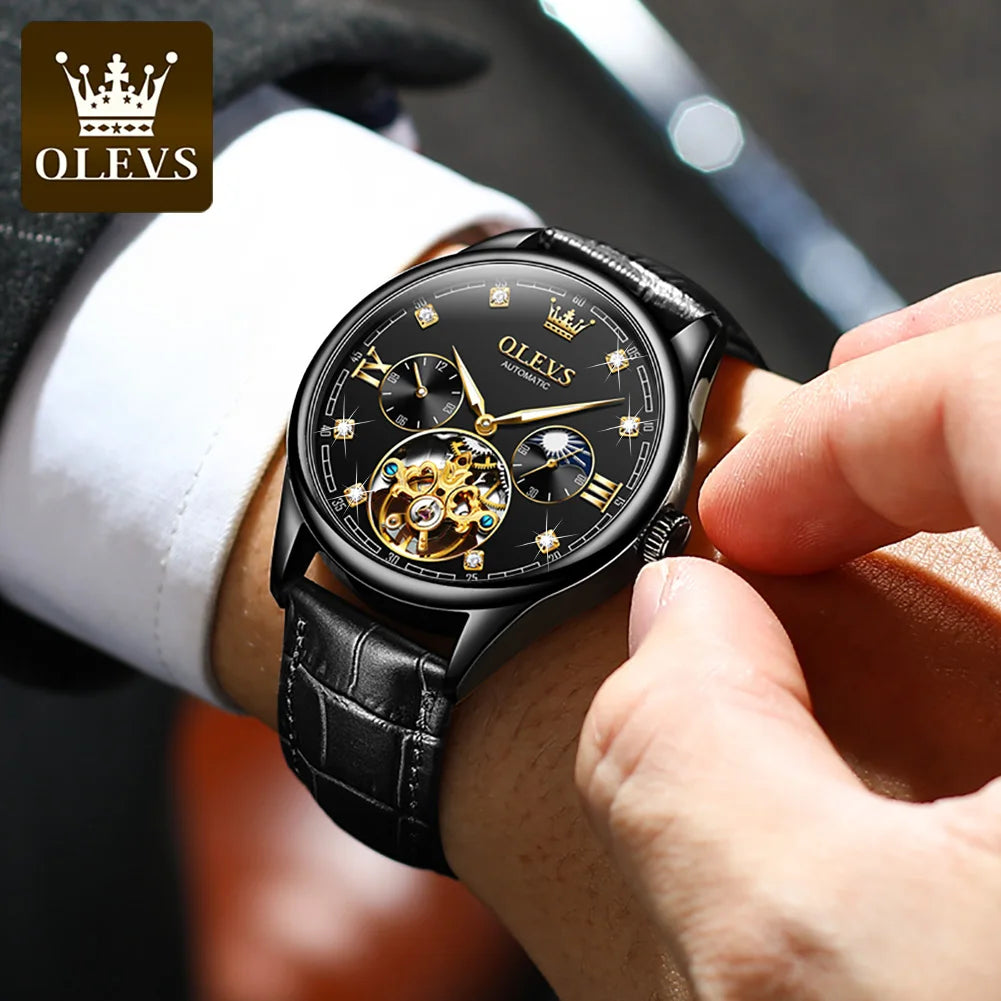 Person wearing a black OLEVS watch with a blurred background