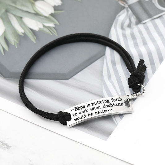 Bracelet with motivational quote on a decorative background