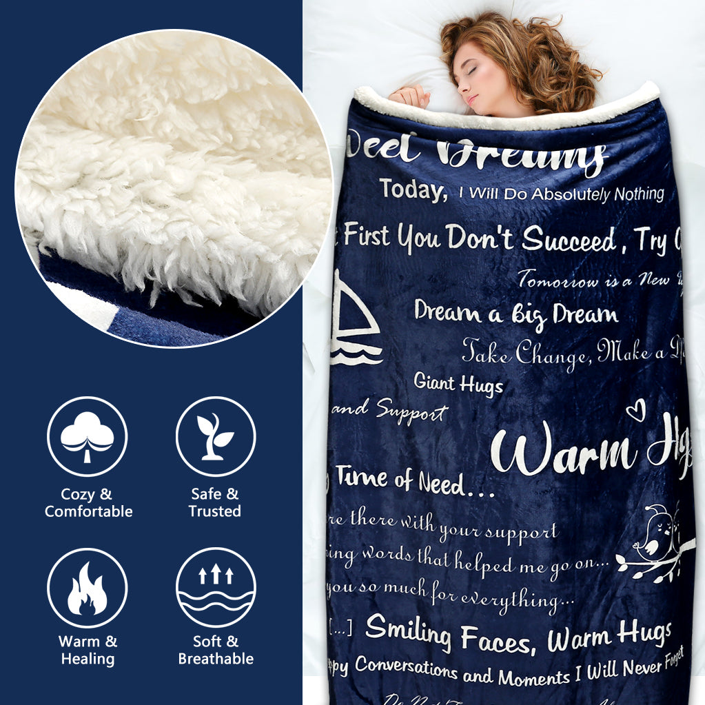 Navy blue blanket with motivational text and fluffy texture close-up on a white background