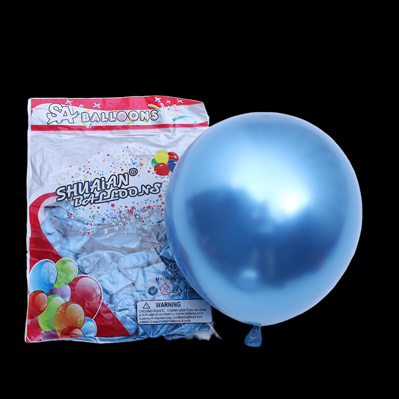Blue balloon next to its packaging on a white background