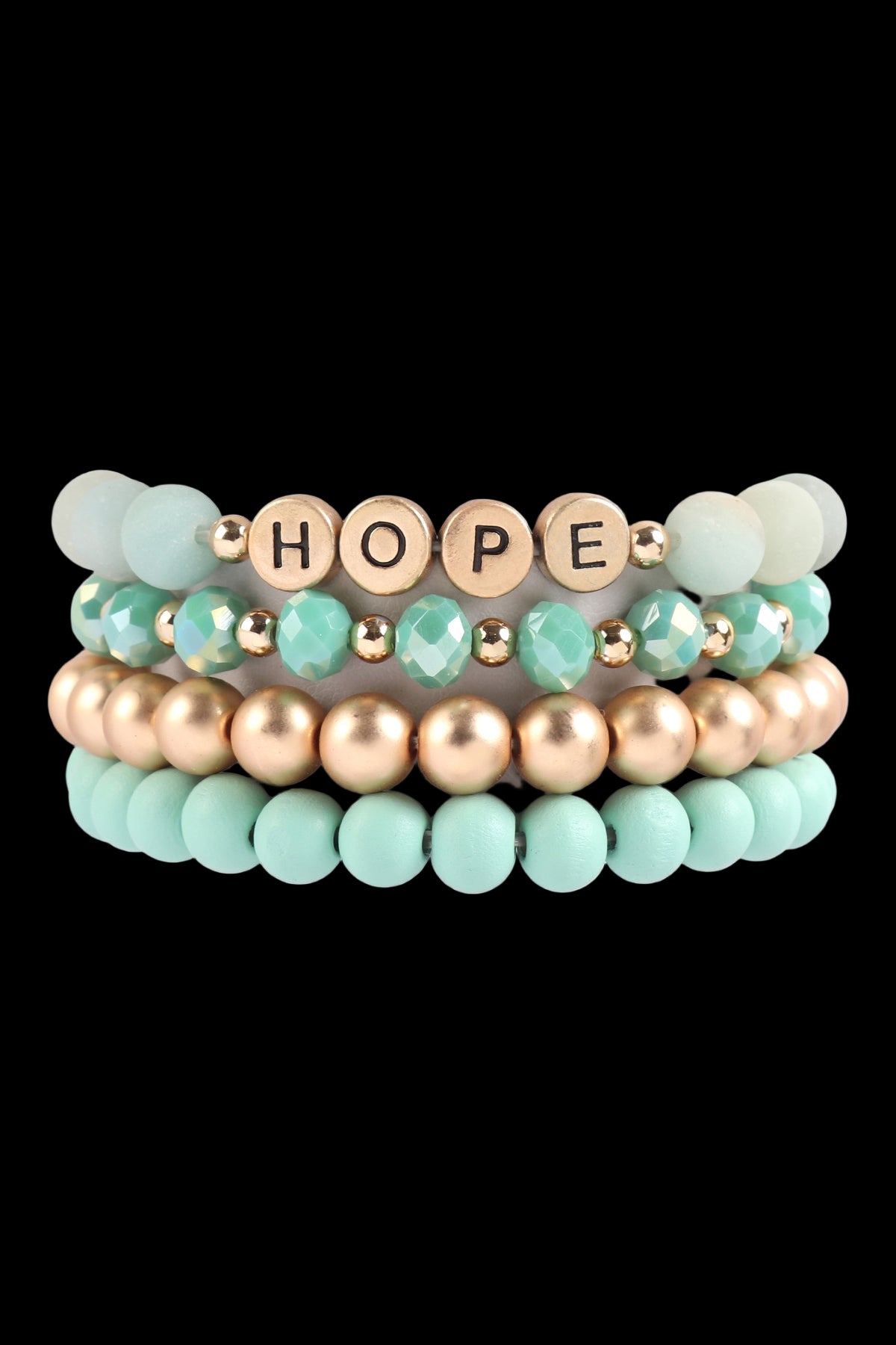 Stack of beaded bracelets with 'HOPE' charm on a white background
