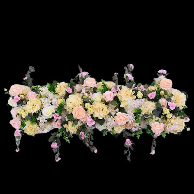 Floral arrangement with pink and yellow flowers on a white background