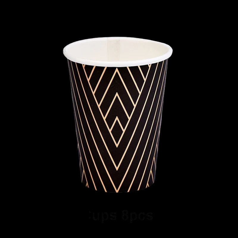 Black paper cup with gold geometric pattern on a white background