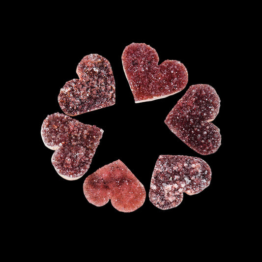 Heart-shaped gummy candies on a white background