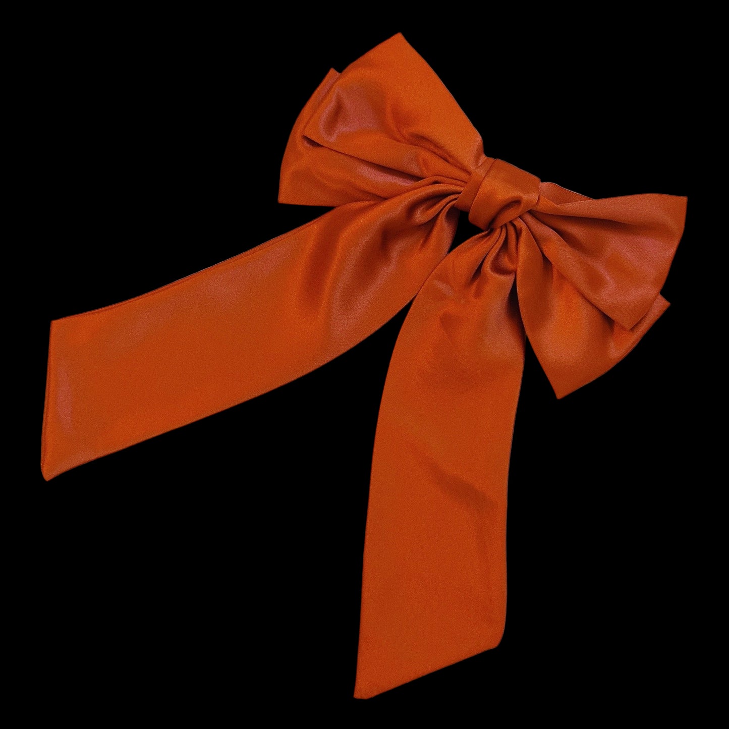 Orange bow on a light gray background