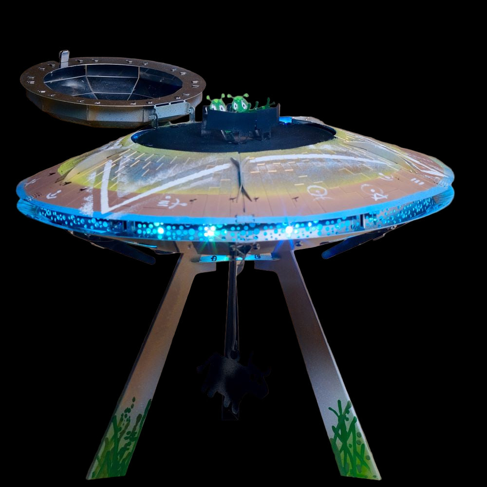 Model of a UFO with glowing blue lights on a beige background
