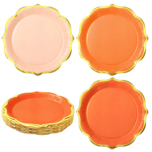 Set of colorful paper plates with gold rims on a white background