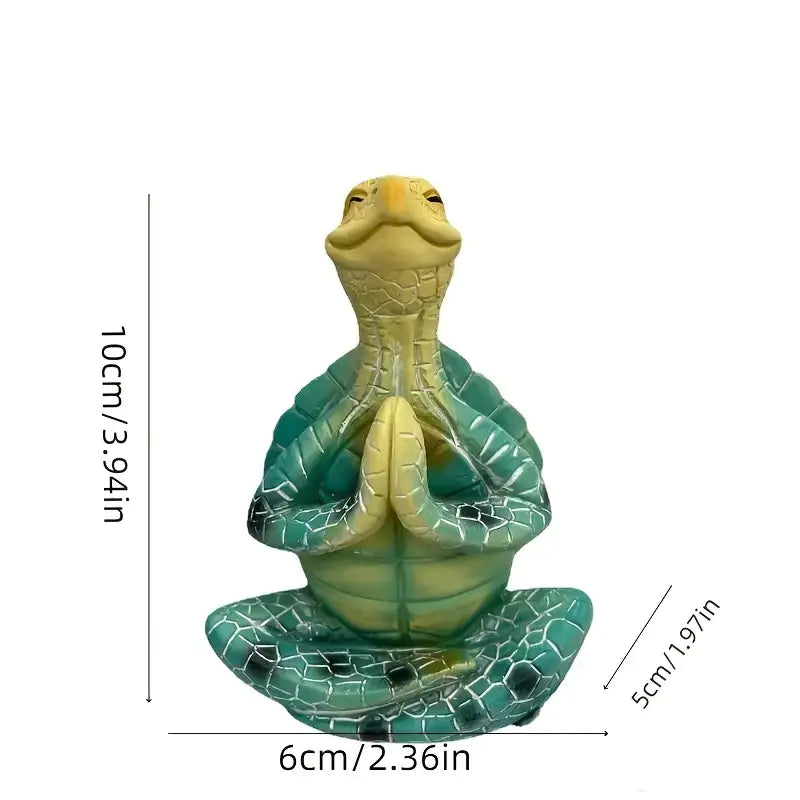 Decorative turtle figurine with measurements on a white background