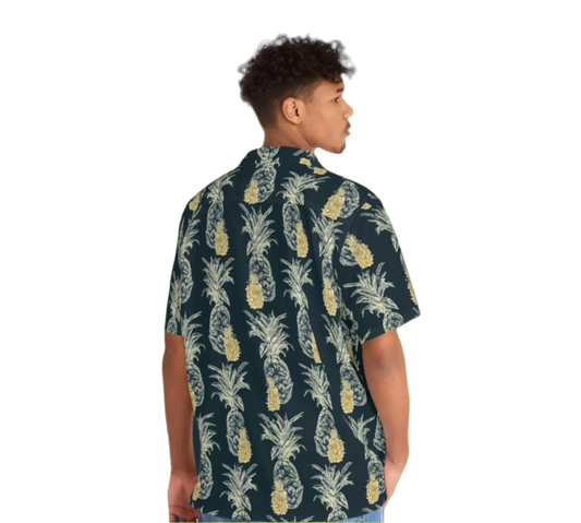 Person wearing a pineapple patterned shirt on a white background