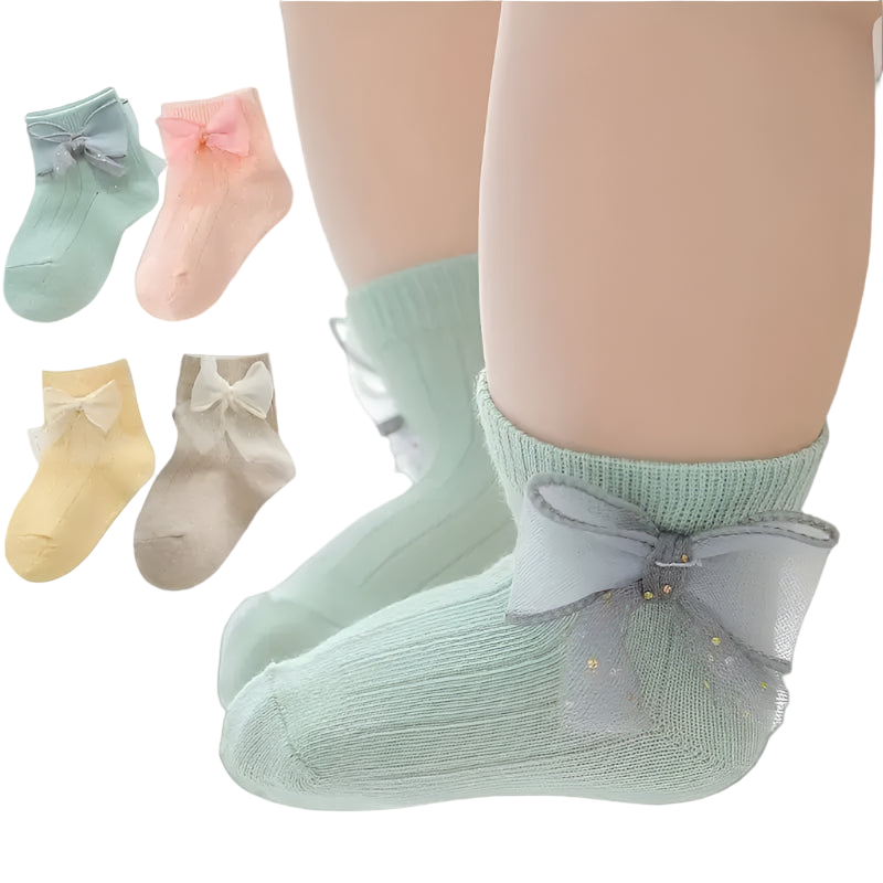 Set of baby socks with bows in various colors on a white background