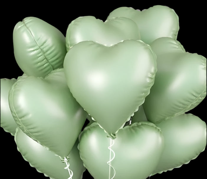 Green heart-shaped balloons on a white background