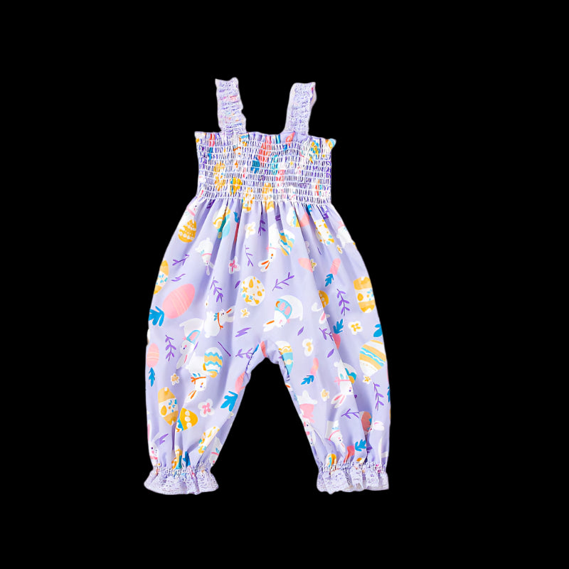 Children's floral romper with matching headband on a beige background