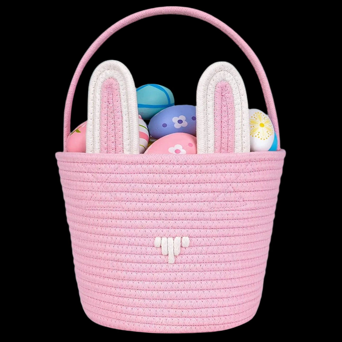 Pink woven Easter basket with bunny ears containing colorful eggs on a white background