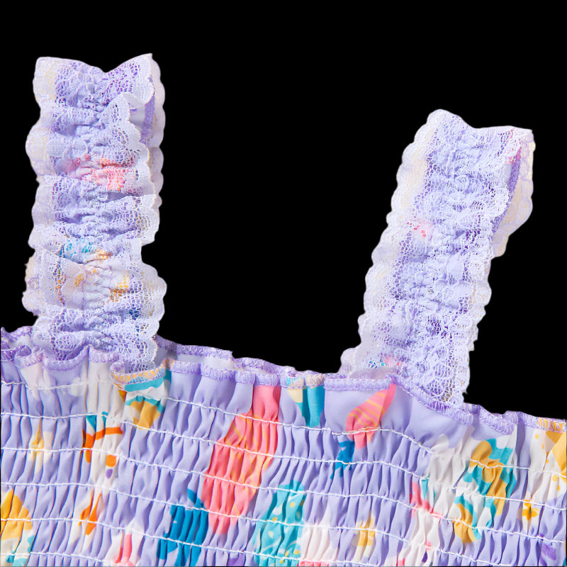 Close-up of a colorful dress with ruffled top on a beige background