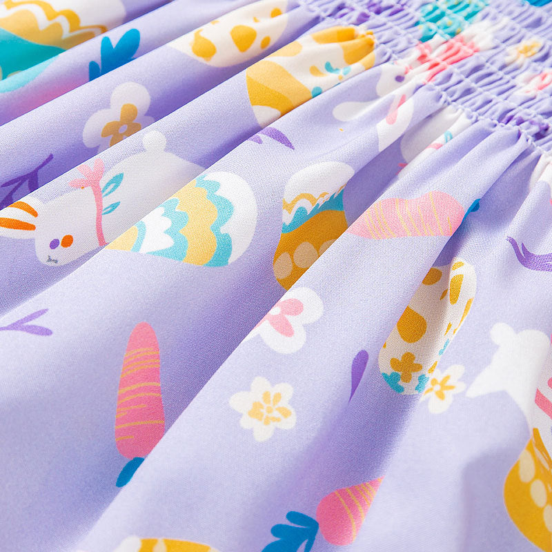 Close-up of colorful fabric with cartoon designs on a purple background