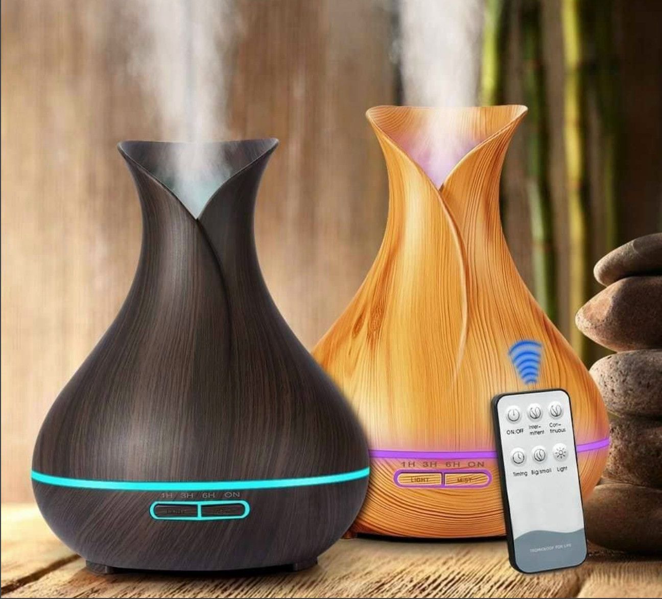 Two wooden diffusers with a remote control on a wooden surface.