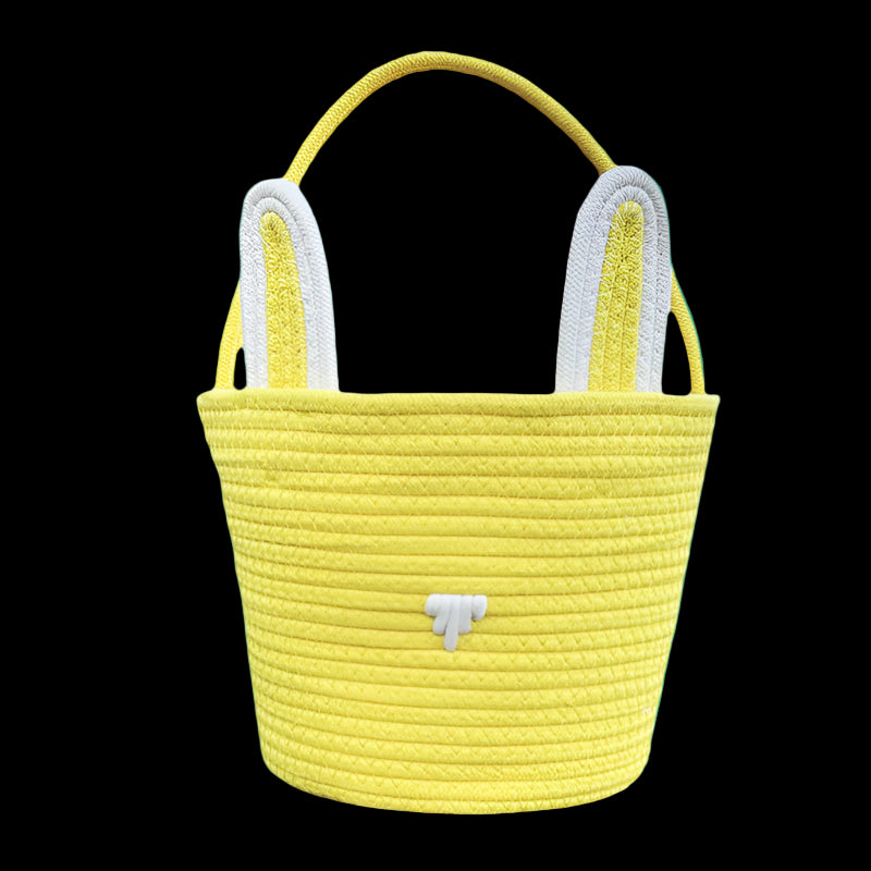 Yellow woven basket with white handles on a white background