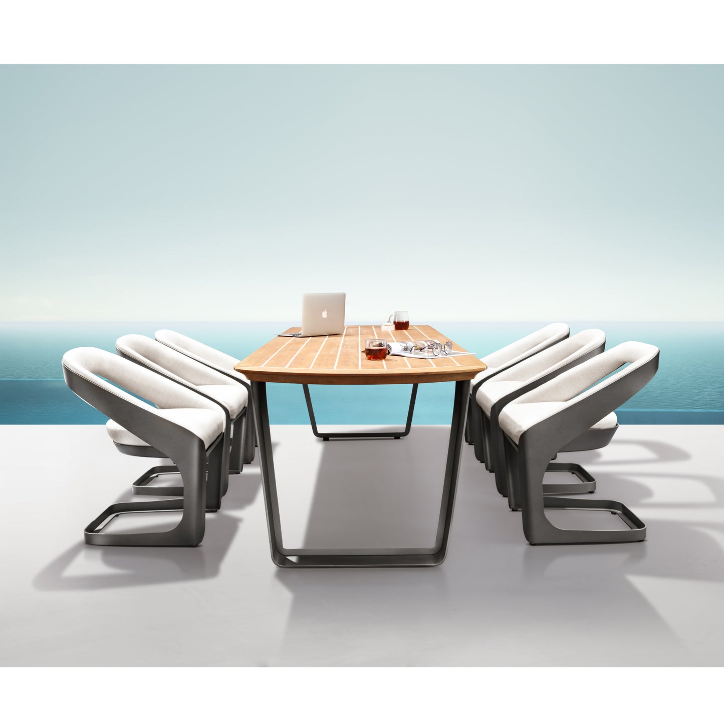 Modern outdoor furniture set with a wooden table and curved bench seats on a light blue background.