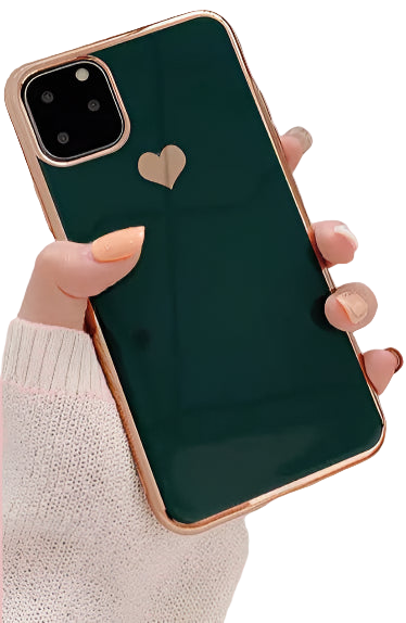 Person holding a phone with a green case featuring a heart design, on a light surface with a clipboard and cup in the background.