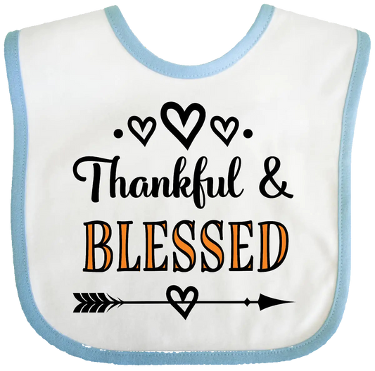Baby bib with 'Thankful & Blessed' text on a white background