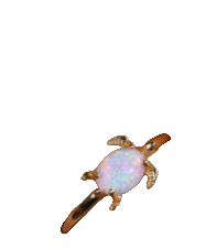 Gold ring with a colorful gemstone on a person's finger against a dark background