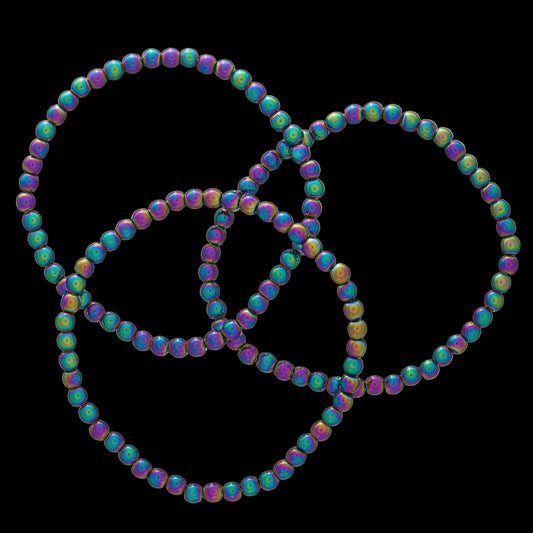 Colorful beaded necklace forming a peace symbol on a white background