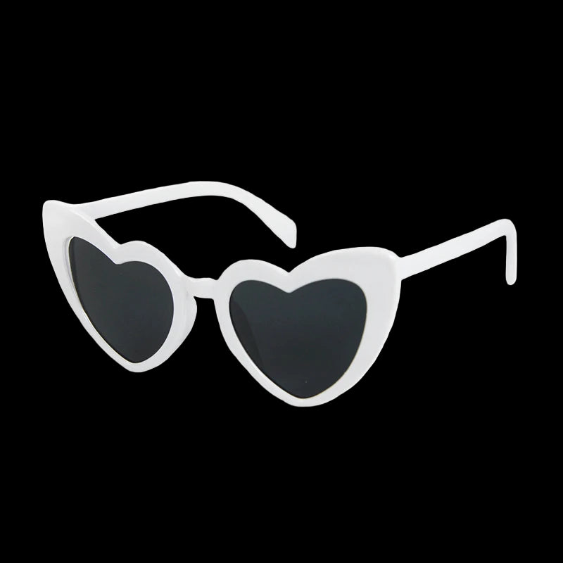 Heart-shaped sunglasses with white frame and black lenses on a white background