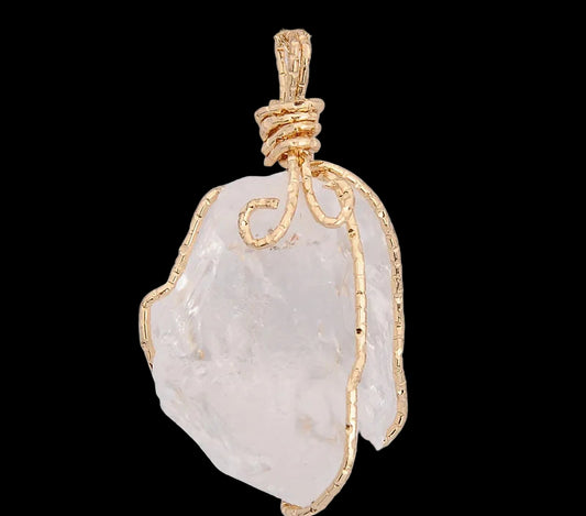 Gold-wrapped crystal pendant on a white background