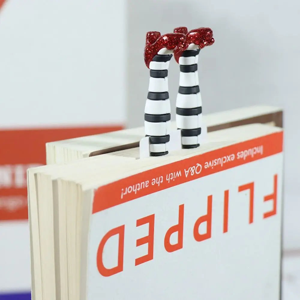 Book with striped legs and red bows on top, titled 'FLIPPED'.