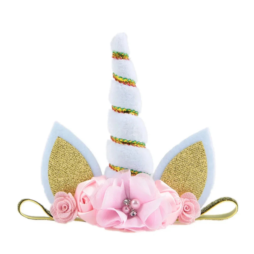 Unicorn horn and ears headband with pink flowers on a white background