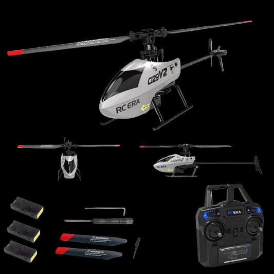 Model helicopter with accessories and remote control on a white background